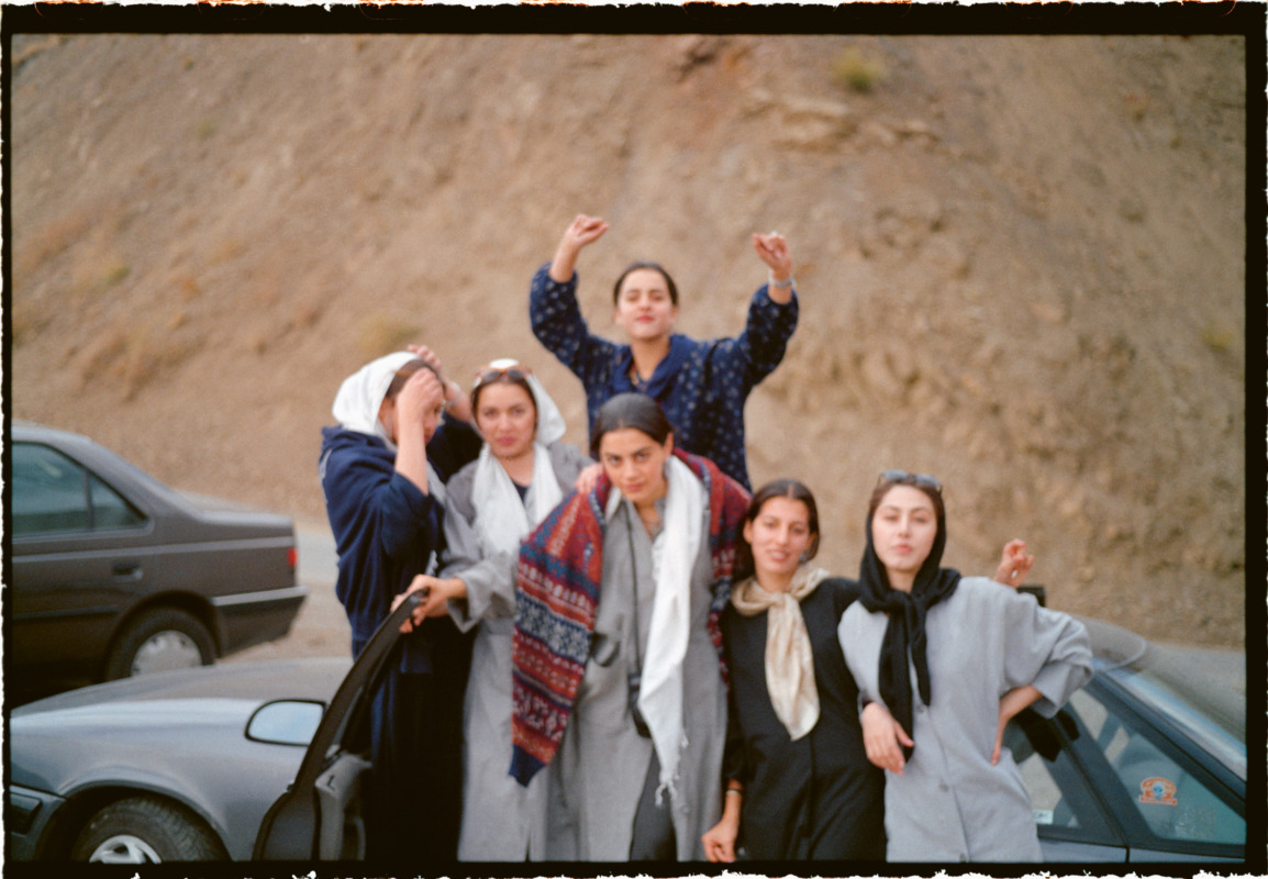 Dancing with friends and their parents in the mountains outside Tehran.(Shemshak, 1998) © Newsha Tavakolian